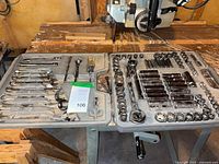 Open case showing full assortment of wrenches and sockets