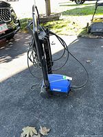 Full view of Simoniz pressure washer upright on driveway