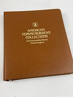 Front cover of brown binder showing title