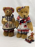 Both Boyd's Bears standing side by side showing outfits and accessories