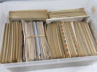 Entire tote showing several tightly packed stacks of First Day Covers