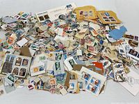 Wide view of entire pile of assorted canceled stamps