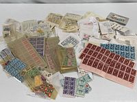 Overview showing numerous glassine envelopes, loose blocks and partial sheets
