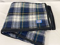 Folded plaid blanket showing pattern and edges