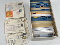 Shoebox filled with organized naval covers in sleeves plus several examples laid out