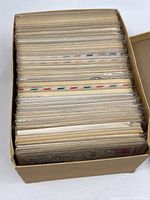 Shoebox filled with sleeved naval covers