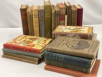 Group shot of all 24 hardcovers, spines and covers visible