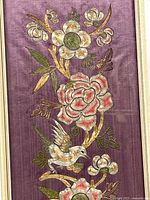 Closeup of lower section showing bird, flowers, metallic thread detail