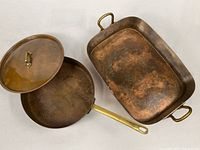 Roasting pan, skillet and lid grouped