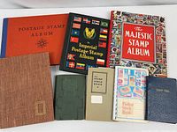 Group shot of eight albums and stock books