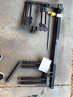 Rack components laid out on garage floor