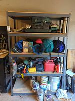 Full frontal view of shelving unit loaded with items (contents excluded)