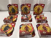 All nine sealed figures arranged on table