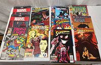 All eleven comics laid out to show fronts