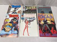 Six comics laid out showing full covers