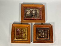 All three framed carved panels front view