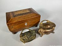 wooden jewelry box with two cast metal trinket boxes