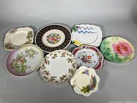 All eight plates laid out showing front designs