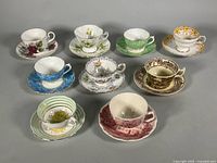 Group shot of nine assorted cup-and-saucer sets