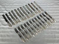 Top view showing full 24-piece set arranged on cloth