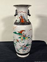 Full view of vase front showing overall form and decoration