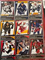 Fronts of first nine cards in plastic sheet