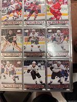 Binder page showing nine of the rookie cards