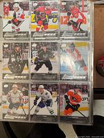 Binder page showing nine Young Guns rookie cards