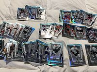 All 50 cards spread out showing fronts with foil borders