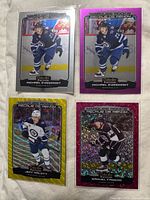 Four sleeved rookie cards laid out: Eyssimont base chrome, Eyssimont Matte Pink, Malott Neon Yellow Surge, Fagemo Violet Pixels 238/299