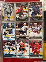 Front view of nine Young Guns cards including Justin Bailey, Teddy Blueger and Trevor Carrick