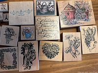 Group view of wood-mounted rubber stamps showing various themes and sizes