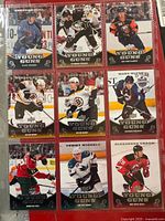 Front view of nine Upper Deck Young Guns rookie cards in binder page