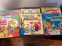 Front covers of six Berenstain Bears titles including Double Dare and Forget Their Manners