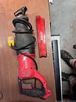 Full view of Craftsman reciprocating saw with wrapped cord and Diablo blade case