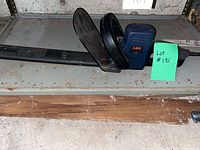 Full view of AEG HS 50 electric chainsaw with bar cover and front guard