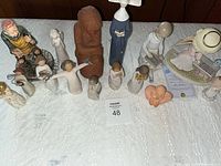 Group shot showing all eleven figurines together