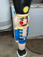 Blue blow-mold nutcracker figure showing condition and design