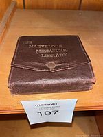 Closed brown leather case front stamped with set name