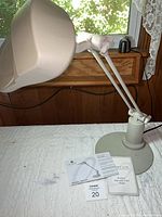 Full view of desktop OTT-LITE lamp with manuals