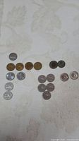 All eighteen coins laid out showing variety and count