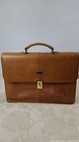Front view of the tan leather Pierre Cardin briefcase