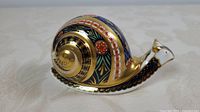 Left side profile of Royal Crown Derby Garden Snail paperweight