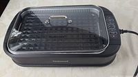 Full view of Techwood smokeless grill with lid on