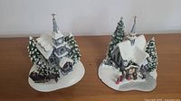Both Thomas Kinkade churches on tabletop