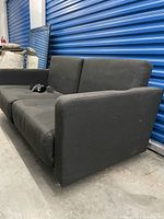 Full right side view of black sofa