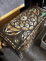 Top view showing overall inlaid pattern of domed lid