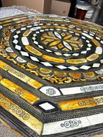 Angled close-up highlighting inlay materials and gloss