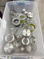 Top view of tote showing multiple clear glass jars with metal lids