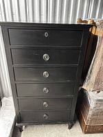front view of black six-drawer chest